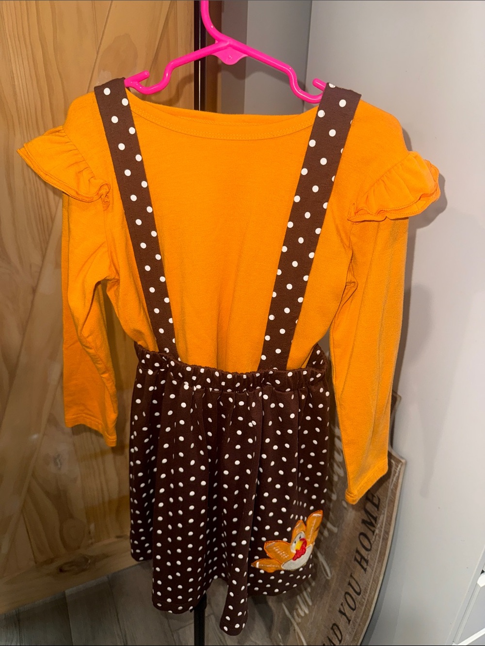 Girls Orange Long Sleeve Top with Brown Polka Dot Suspender Skirt
